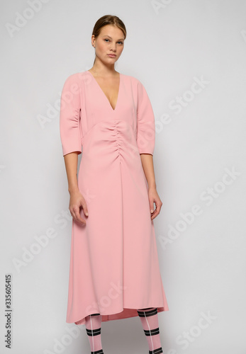 Fashion shooting in studio . Professional model , fashionable clothes and style, new collection. stylish look