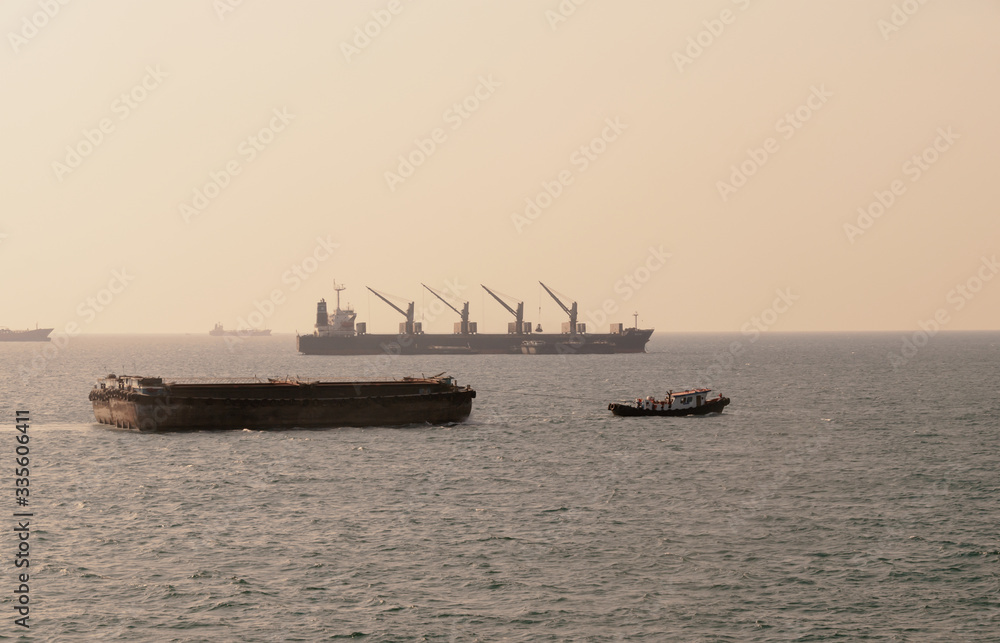 Silhouette Logistics and transportation of International Container Cargo ship in the ocean