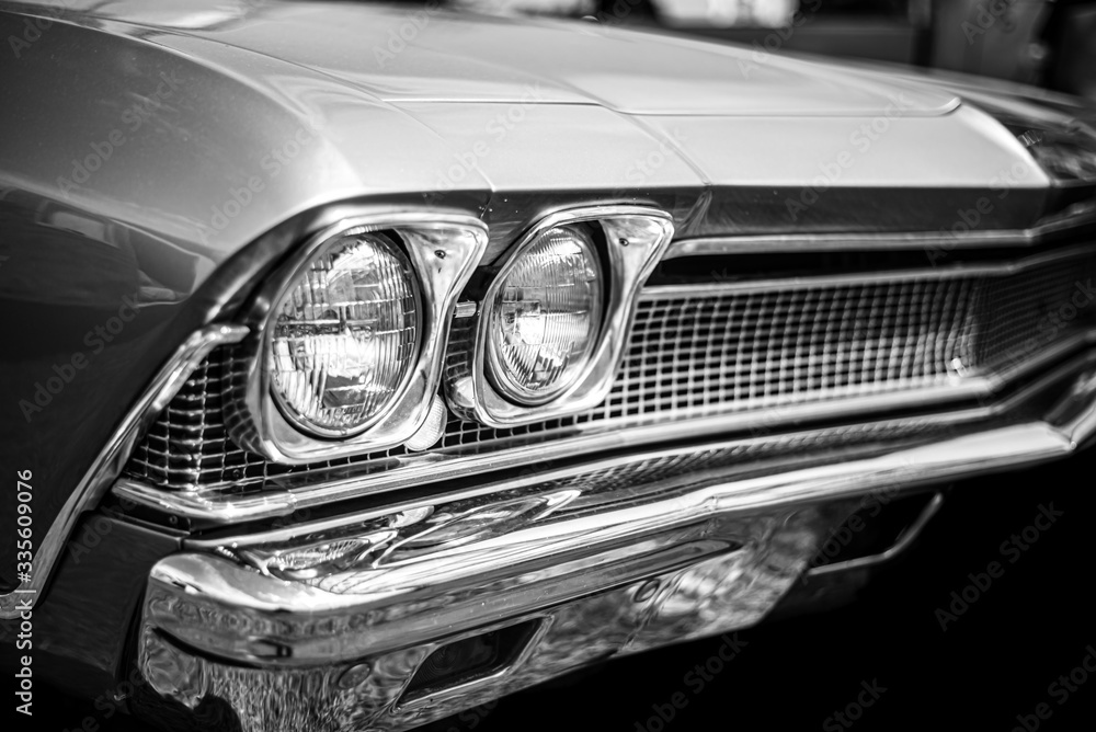 an old muscle car in black and white