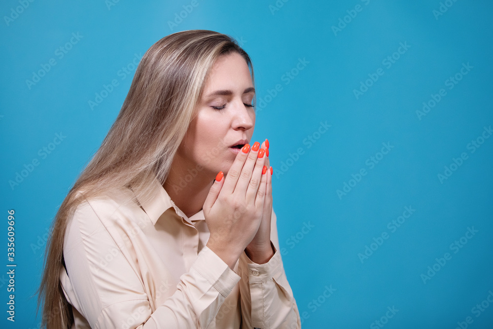 Woman sneezes. Coronavirus. Covid-19. 2019-ncov. Woman sneezes. Coronavirus. Covid-19. 2019-ncov.