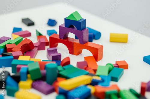 Multi-colored blocks of a wooden constructor. Concept of development of preschool children.