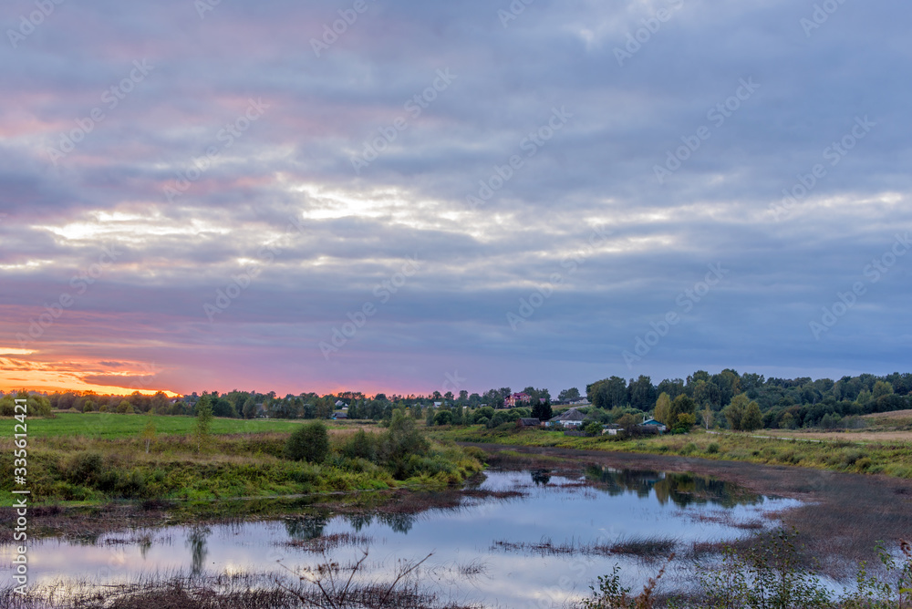 Rural landscape with river at sunset. Central Russia, Yaroslavl region, Uglich