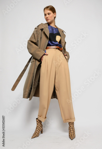 Fashion shooting in studio . Professional model , fashionable clothes and style, new collection. stylish look