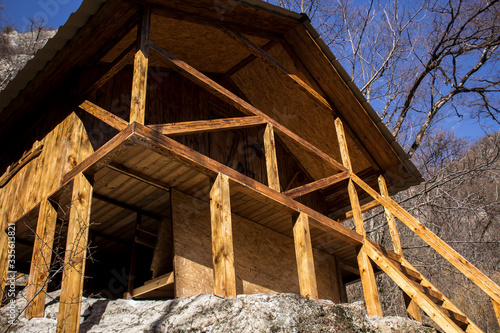 wooden hut on a stone