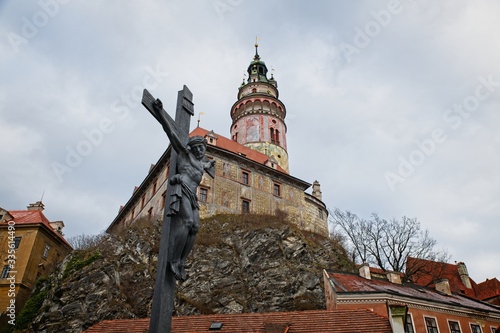 Statue of Jesus Christ on a bridge over the Vtava River in the centre of Český Krumlov, Czech Republic photo