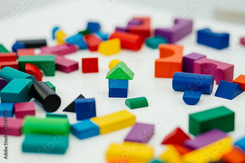 Multi-colored blocks of a wooden constructor. Concept of development of preschool children.