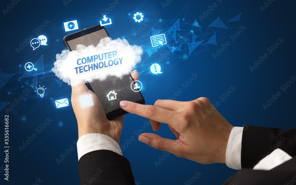 Female hand holding smartphone with COMPUTER TECHNOLOGY inscription, cloud technology concept Female hand holding smartphone with COMPUTER TECHNOLOGY inscription, cloud technology concept