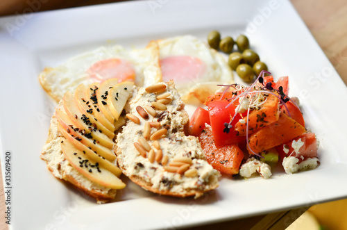 food, fried eggs with vegetables and toast on a plate photo