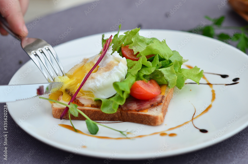 food, poached an egg on toast with vegetables on a plate food, poached an egg on toast with vegetables on a plate