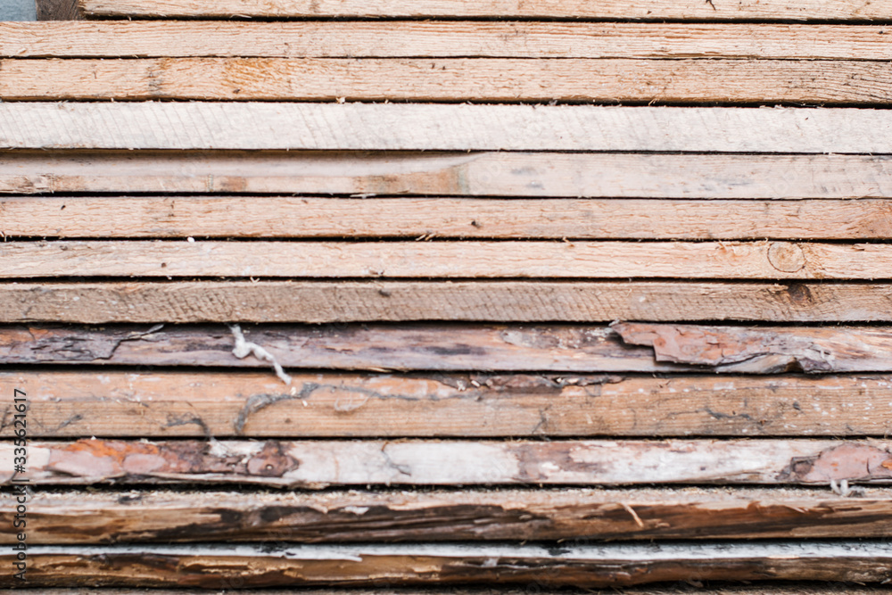 Obraz premium Firewood for the winter, stacks of firewood, pile of firewood. sawmill