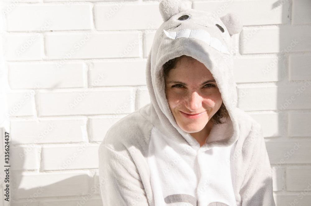 Portrait of girl in funny costume. Smiling face. Woman face. Brick wall Portrait of girl in funny costume. Smiling face. Woman face. Brick wall