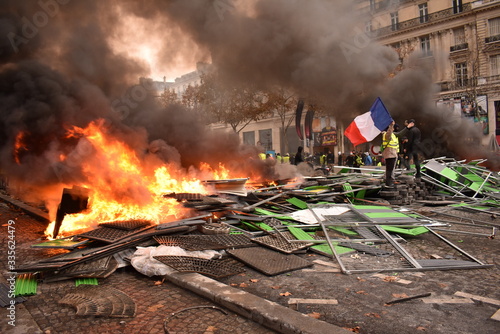 Bild auf Leinwand Pile of things burning on the street by yellow vest protestors in Paris France