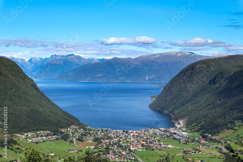 Sognefjord coast wide clear aerial blue view on Vikoyri town, Norway biggest fjord. Beautiful bay, aerial summer scenery. Travel natural destinations