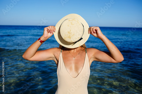 Happy, sexy, girl face closed hat, rest, sun. Open red sea