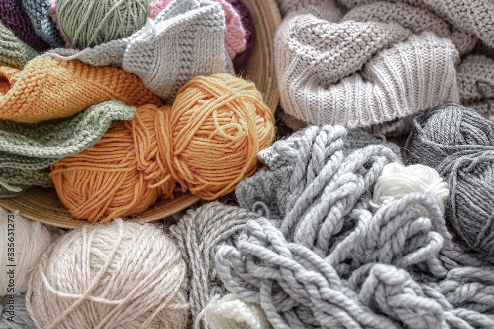 Different yarn for knitting in pastel and bright colors.