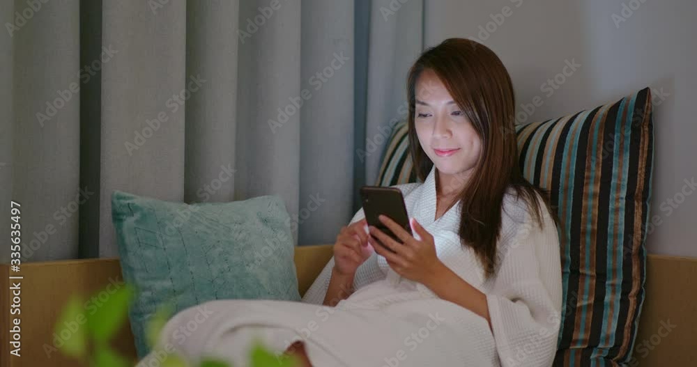 Woman use of mobile phone at hotel Woman use of mobile phone at hotel