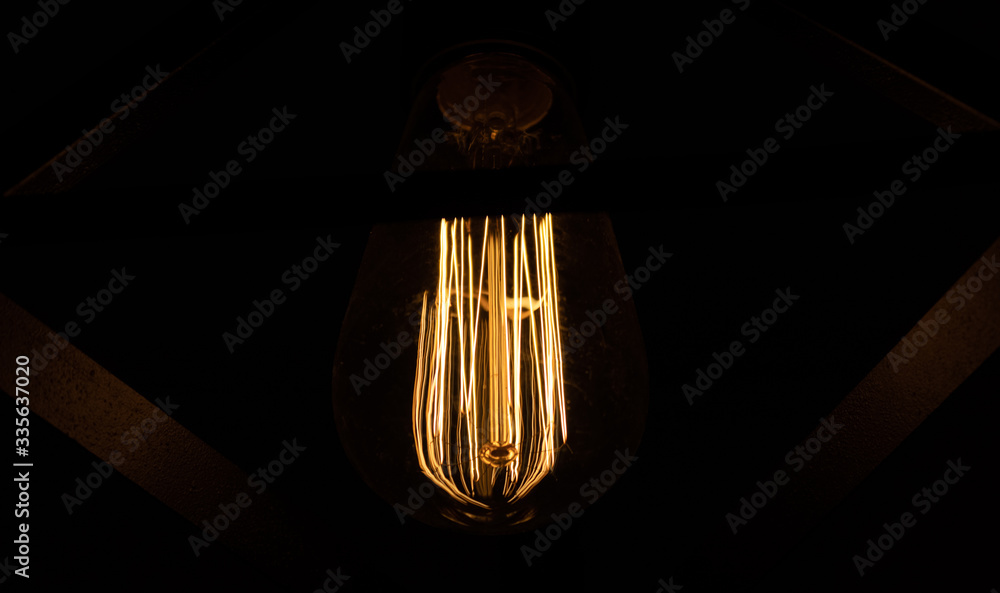 authentic bulb on a black background with detail close up 