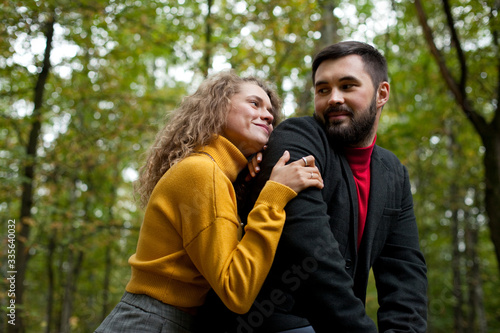 Girl hugs guy and smiles double portrait in park © Михаил Степанов