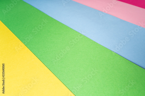 Multi colored abstract paper of pastel colors with geometric shape.
