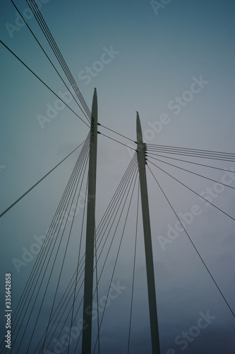 cable bridge over blue sky
