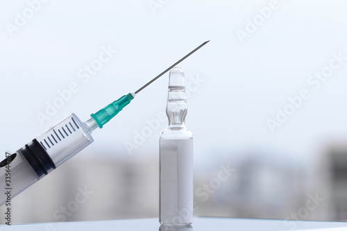Transparent glass drug ampoules and syringe