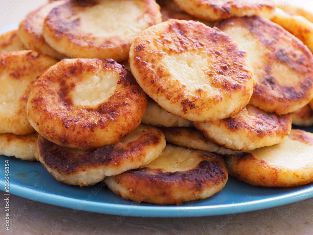 Cheesecakes are piled on a plate.Delicious cheesecakes with a Golden crust are piled on a plate Cheesecakes are piled on a plate.Delicious cheesecakes with a Golden crust are piled on a plate