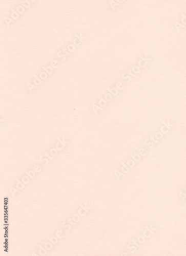 Elegant beige paper background. Sandy and peachy colored pastel paper. Warm modern textured sheet of paper. Abstract homogeneous flatlay, top view. Vertical format. Free space for your text.