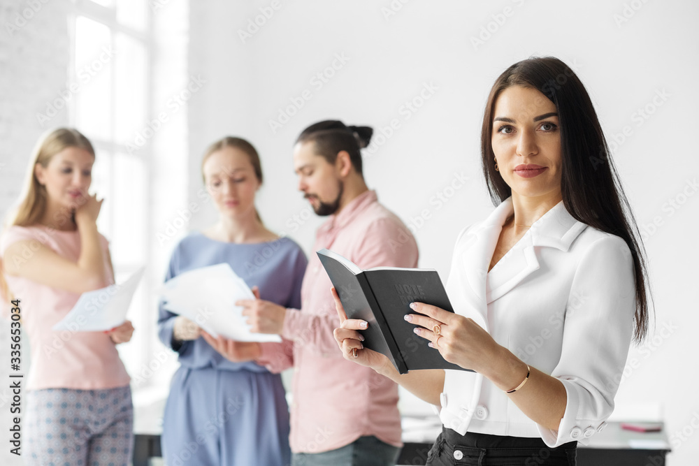 Successful business woman in office. Woman boss. Team leader. The concept of entrepreneurs, business and work on success. Successful business woman in office. Woman boss. Team leader. The concept of entrepreneurs, business and work on success.
