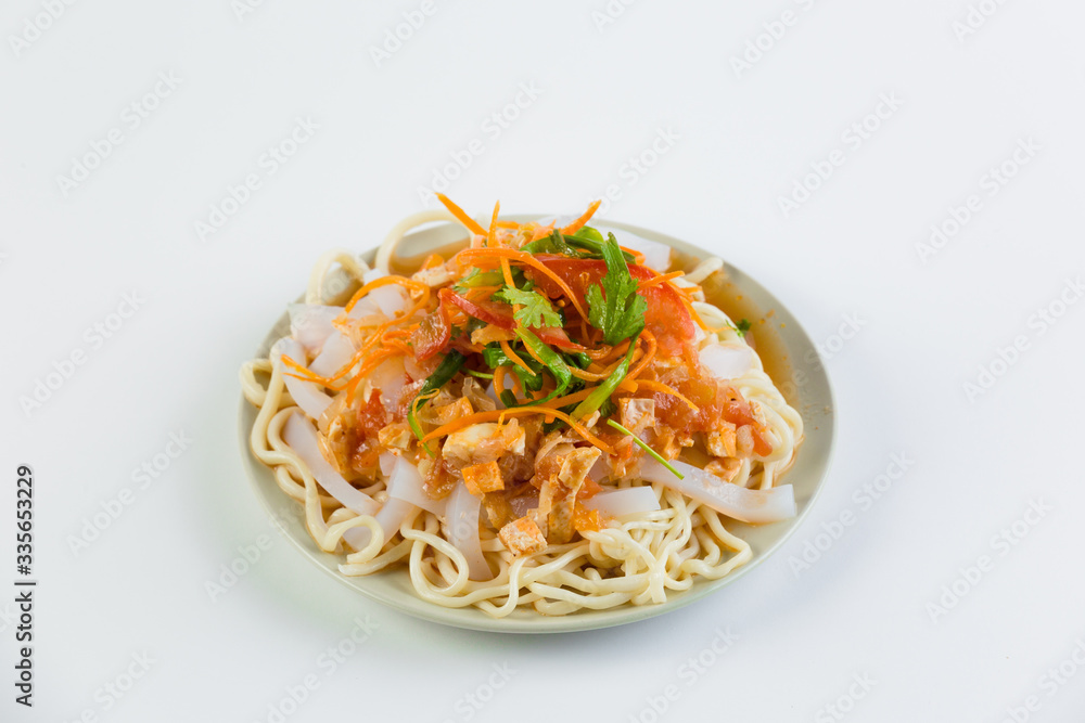 Delicious asian food in take-out box. Close up on noodles with fried vegetables and seafood then stirred soy sauce. Food delivery service. Delicious asian food in take-out box. Close up on noodles with fried vegetables and seafood then stirred soy sauce. Food delivery service.