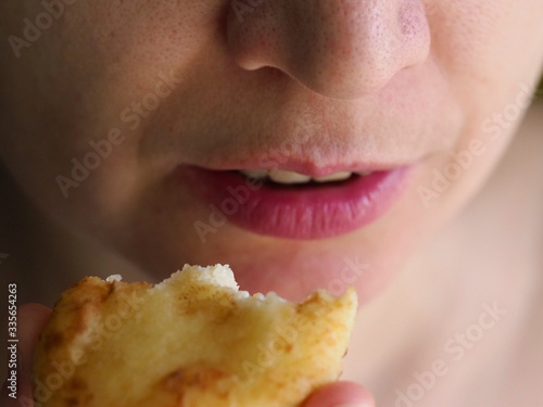 Girl eating Cottage cheese pancakes close up. A girl eats a cottage cheese pancake close up.