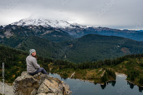 Woman Sits on Outcropping from Tolmie Peak