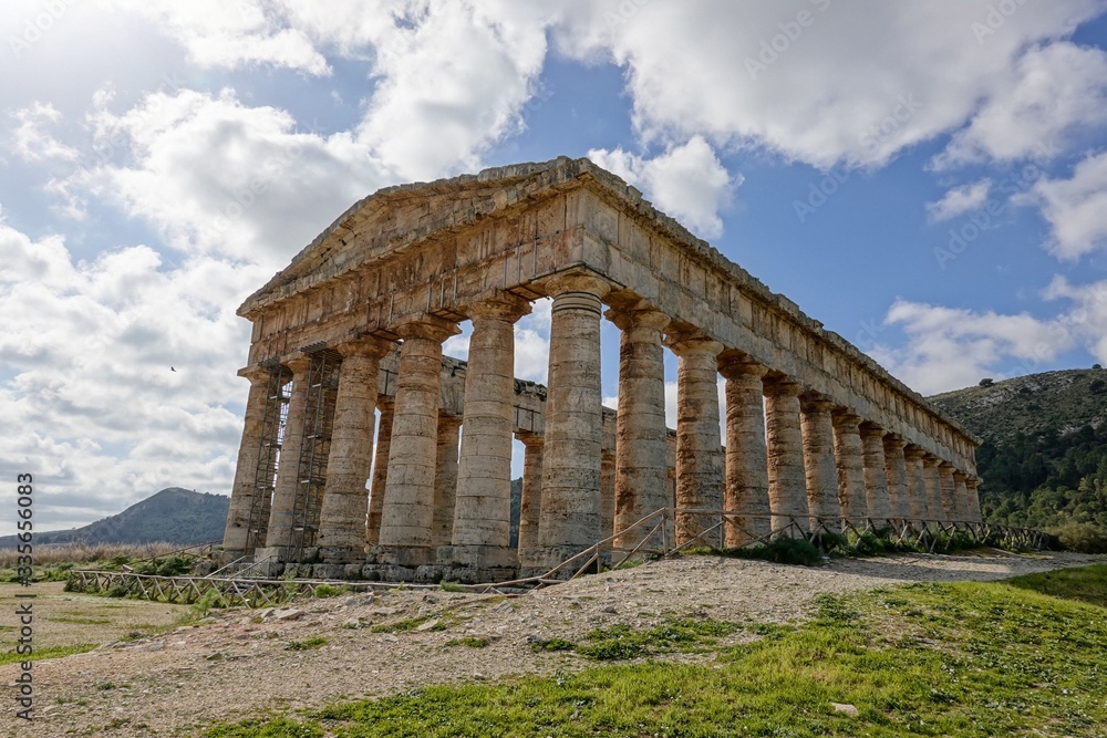 Ancient Doric temple of Segesta which is under reconstruction in sunny spring day with blue sky and perspective view