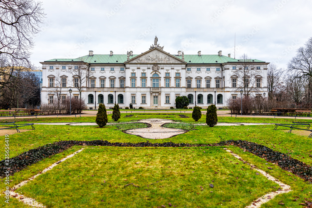 Warsaw, Poland Krasinski palace with park garden green grass in winter of Warszawa cloudy day exterior facade architecture view
