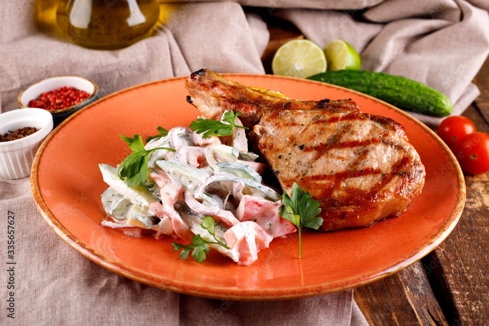 Roast pork loin served with vegetables in sauce Roast pork loin served with vegetables in sauce