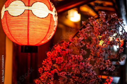 Εκτύπωση καμβά Kyoto, Japan alley colorful street in Gion district at night with closeup of ill