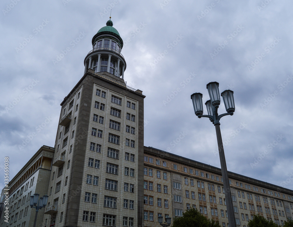 Karl Marx Allee, near Frankfurter Tor, in East Berlin, Germany. Typical socialist classicism architecture. Karl Marx Allee, near Frankfurter Tor, in East Berlin, Germany. Typical socialist classicism architecture.