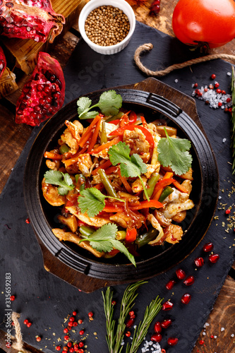 Stir fry chicken, sweet peppers and green beans.