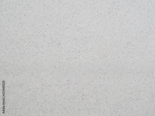 Surface texture light grey synthetic stone, background.
