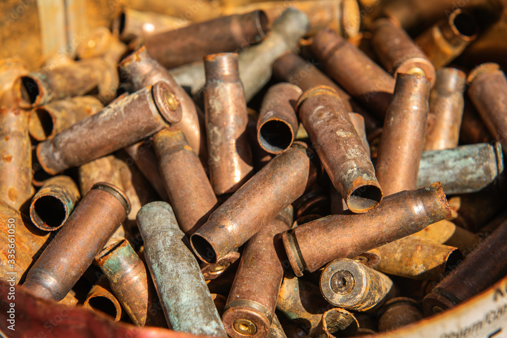 filled frame rusty used gun bullets Empty brass shells filled frame rusty used gun bullets Empty brass shells