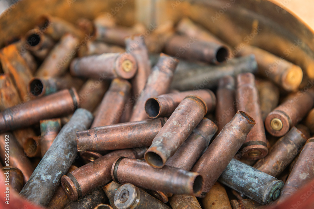 filled frame rusty used gun bullets Empty brass shells filled frame rusty used gun bullets Empty brass shells