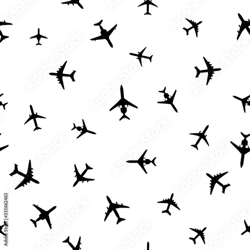 Airplanes silhouettes on white. Abstract seamless pattern. Vector EPS10.