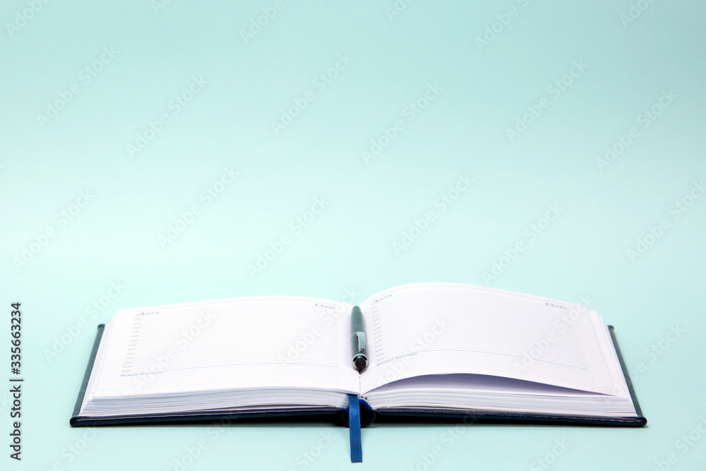 Open diary on a colored background
Open diary on a colored background