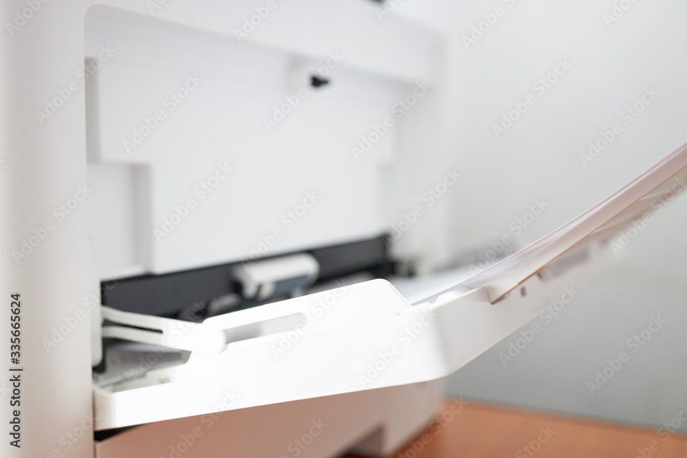 workplace with close up view to copy machine at office. paperwork, stationery and procrastination concept. workplace with close up view to copy machine at office. paperwork, stationery and procrastination concept.