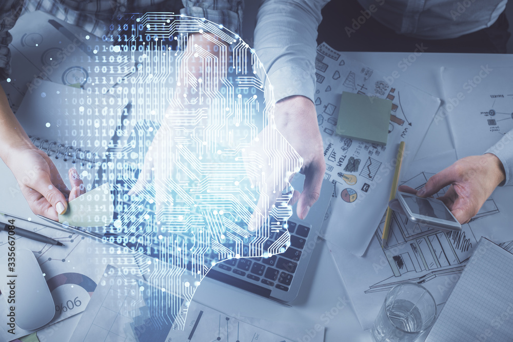 Double exposure of man and woman working together and human brain hologram drawing. Brainstorm concept. Computer background. Top View. Double exposure of man and woman working together and human brain hologram drawing. Brainstorm concept. Computer background. Top View.