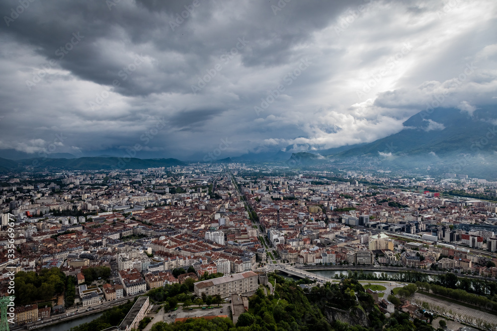 Fototapeta premium View from the Fort de La Bastille looking down on Grenoble with the Cours Jean Jaurès stretching straight into the horizon