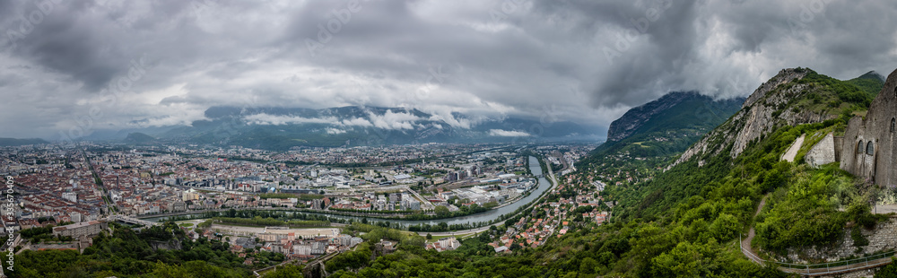 View from the Fort de La Bastille looking down on Grenoble with the Isere river and steep granite mountains on the right