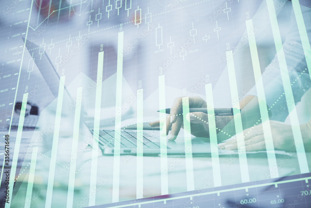 Double exposure of woman hands typing on computer and forex chart hologram drawing. Stock market invest concept. Double exposure of woman hands typing on computer and forex chart hologram drawing. Stock market invest concept.