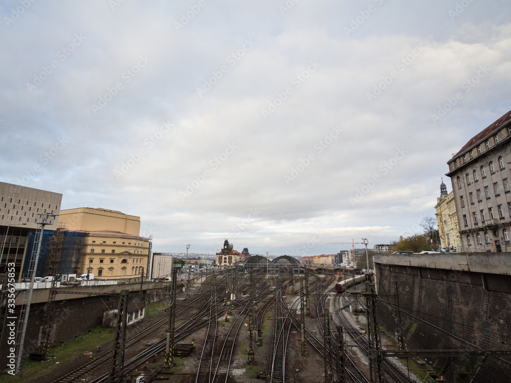 Naklejka premium Panorama of the entrance to Main hall of Prague main train station, Praha Hlavni Nadrazi, with platforms, rails & trains. It is the most important railway hub of the city