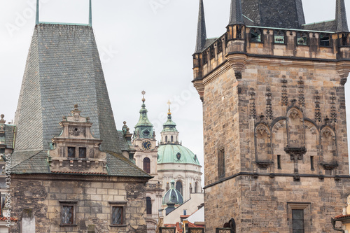 Malostranska panorama, with the lesser town bridge tower of Charles Bridge, also called malostranska mostecka vez and St Nicholas Church, also called Kostel Svateho Mikulase, in Prague, Czech Republic photo