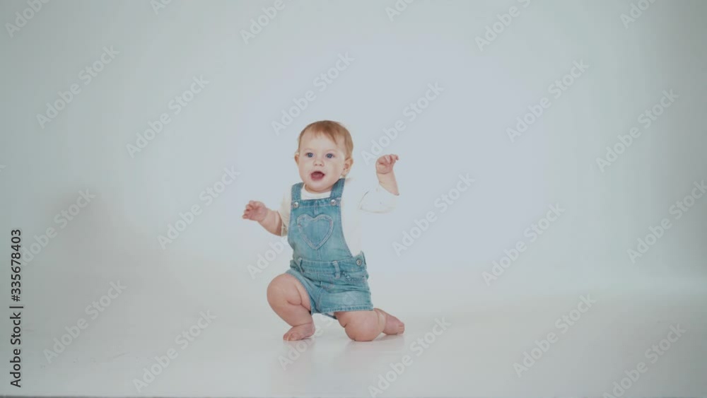 emotions of a child who is learning to walk. studio shooting emotions of a child who is learning to walk. studio shooting